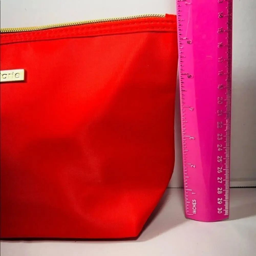 Tarte red cosmetic bag/ clutch, nice size with beautiful purple satin interior